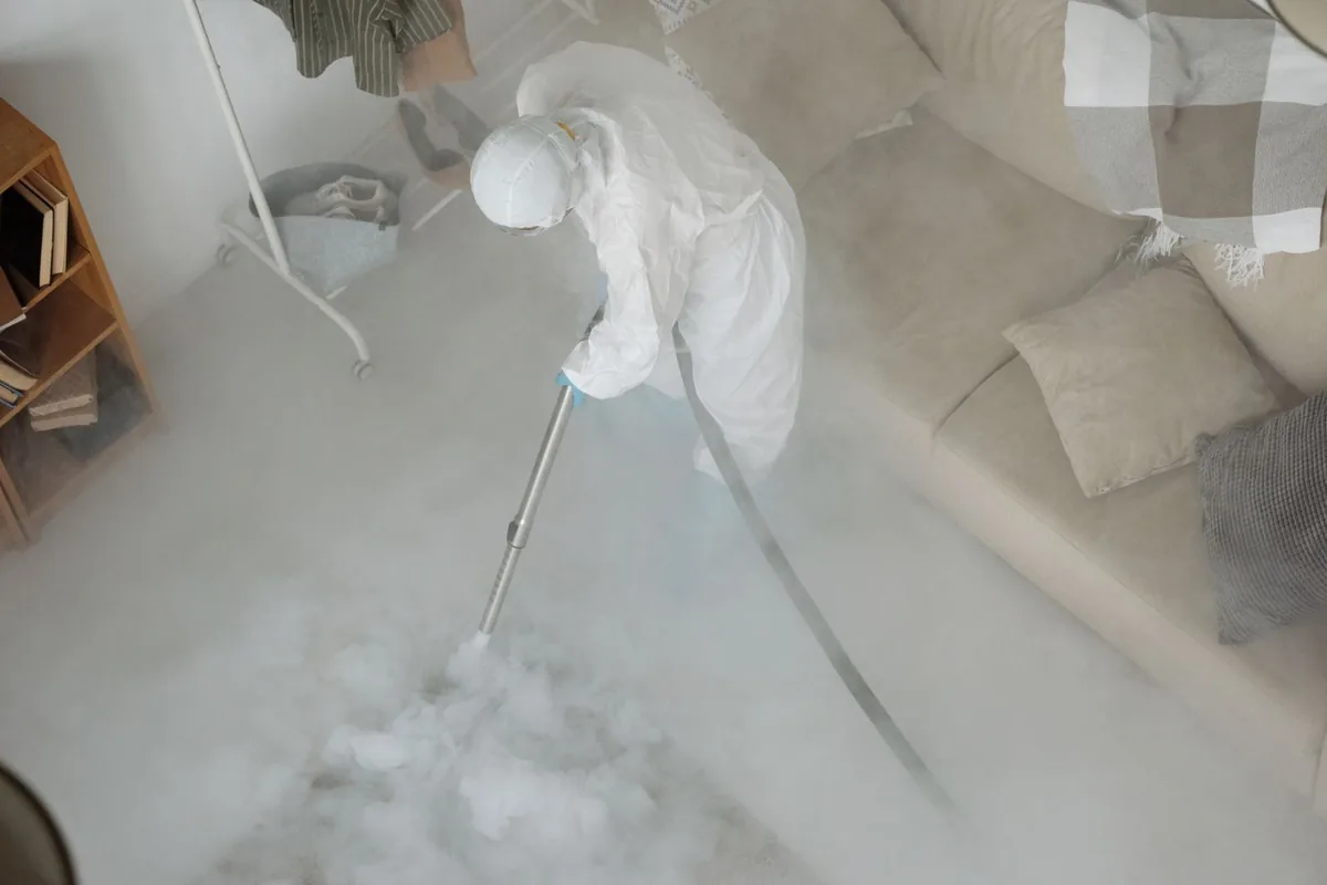 Biohazard cleanup technician in protective equipment, Vinita Park, MO